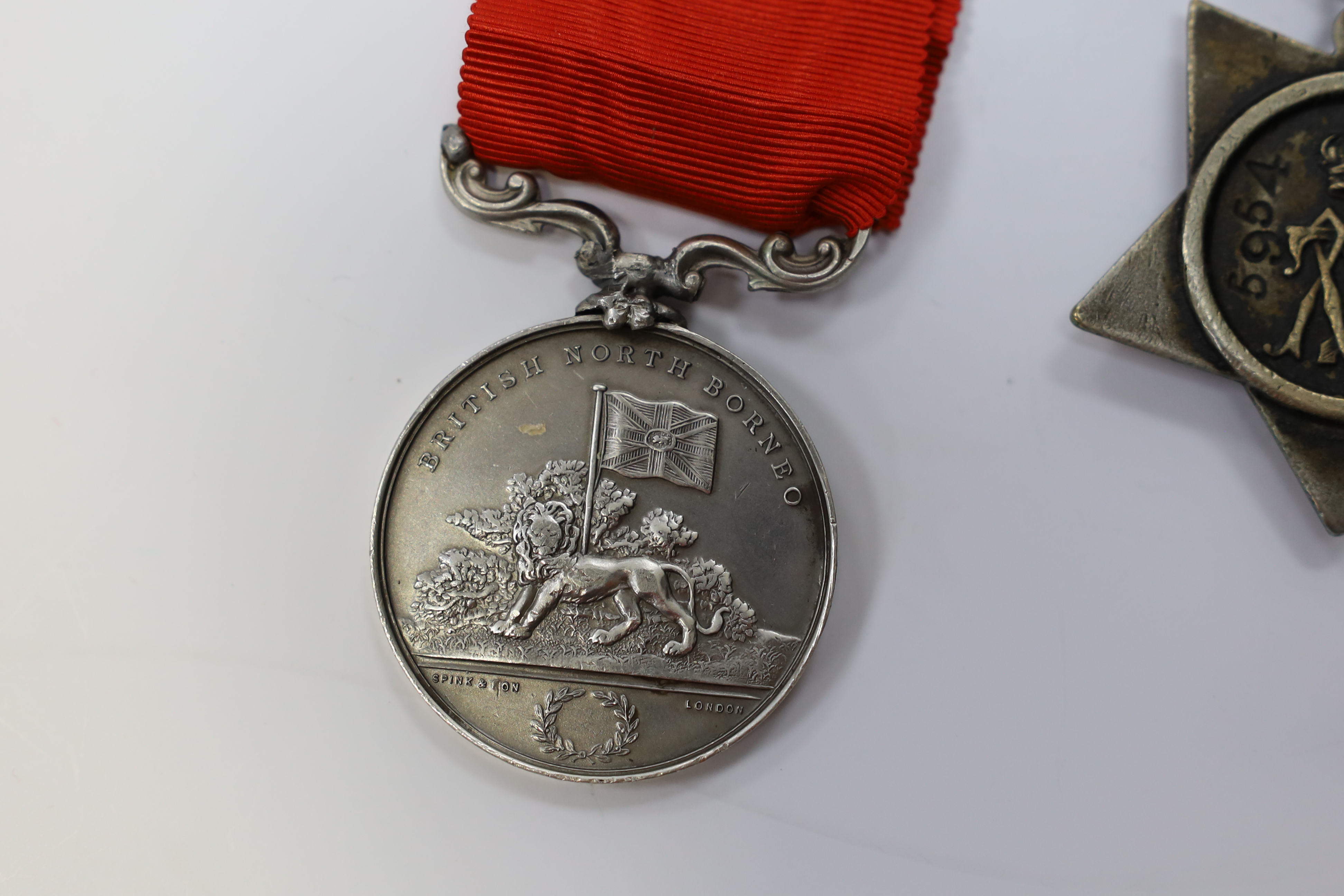 Replica medals; Khedive's Star 1884-6 and another undated; Ashanti star; Spink British North Borneo medal, a loose North West Frontier 1930-31 clasp and a Total Abstinence India medal 50-80